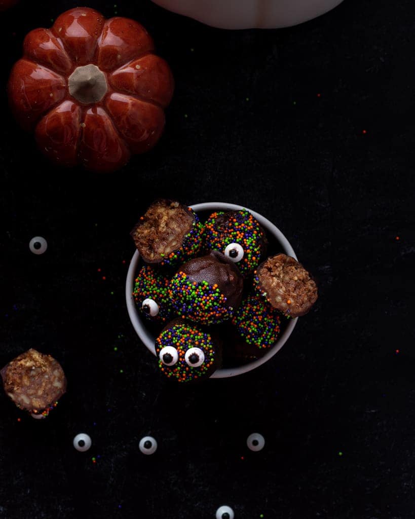 Halloween Chocolate Truffles in a ramekin topped with sprinkles and eye ball candies.