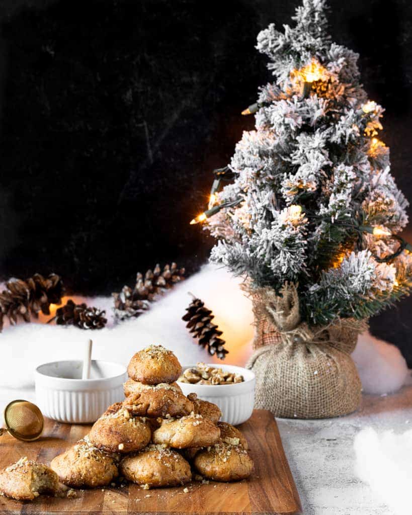 Greek Christmas Honey Cookies displayed on a festive background.