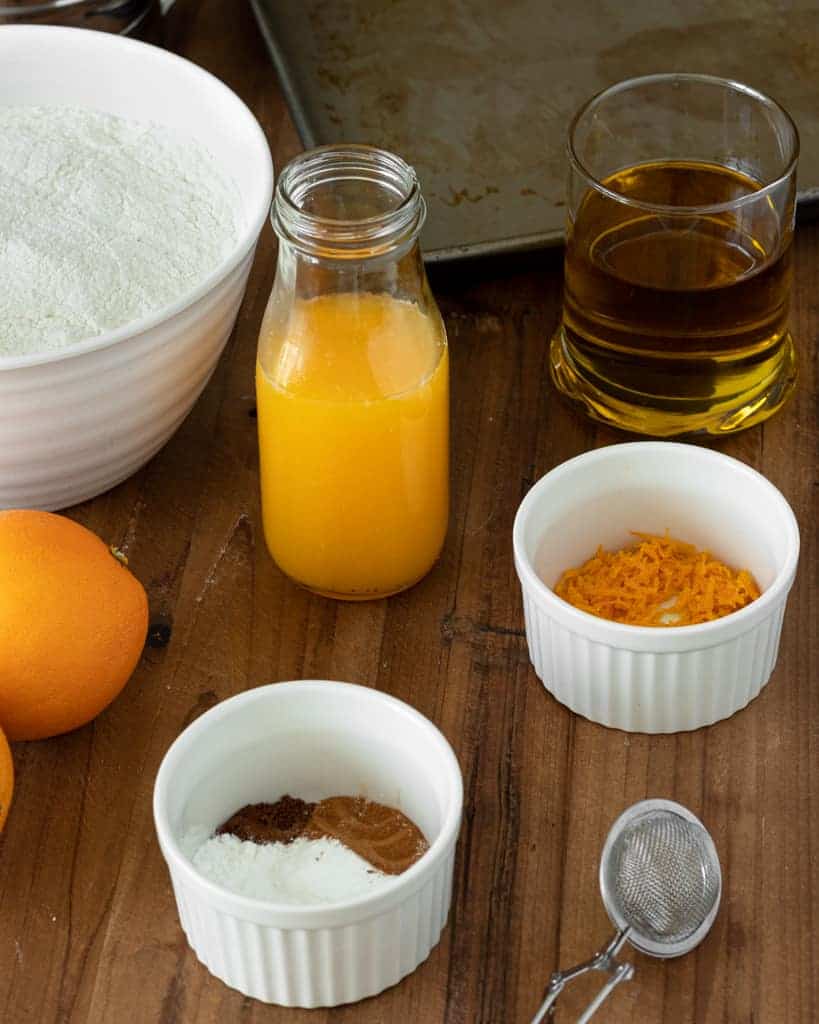 The ingredients needed to make orange cookies.