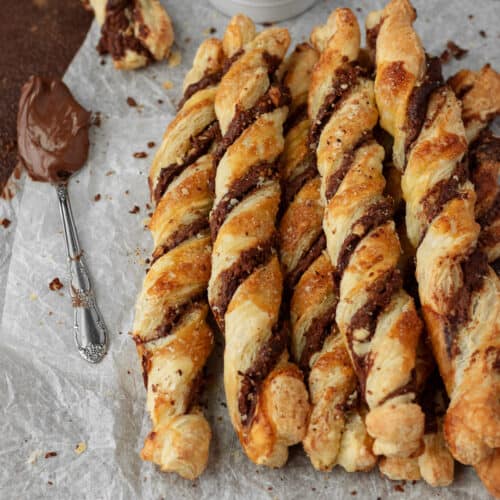 Photo of chocolate puff pastries on parchment paper.