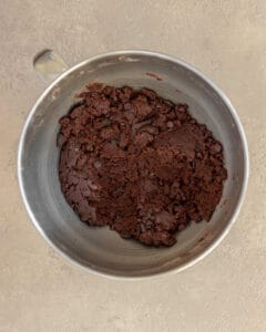 Photo of the chilled dough for the double chocolate tahini sesame cookies in the mixing bowl.