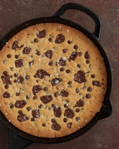 Photo of the salted caramel skillet cookie sprinkled with flaky salt.